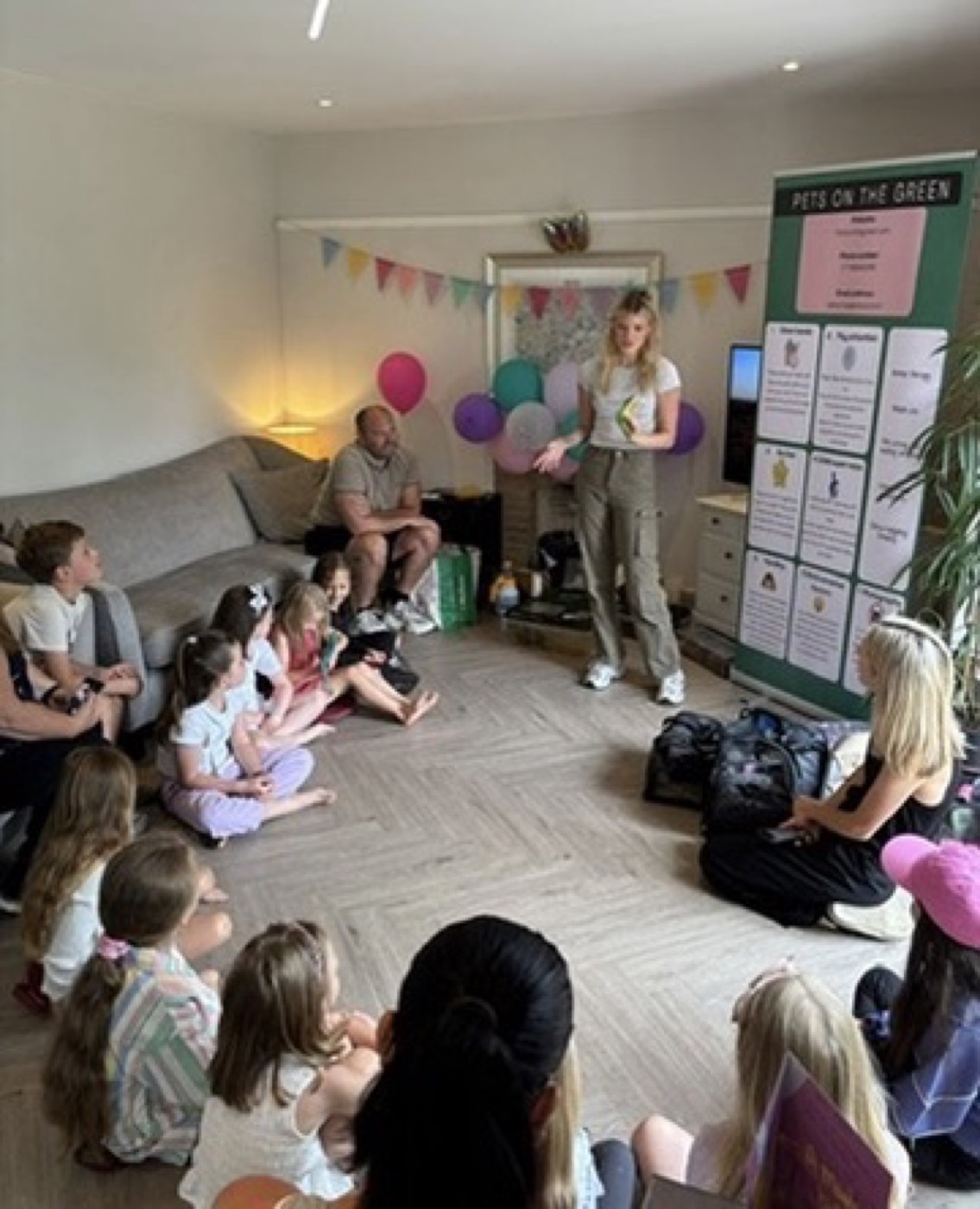 Ciera presenting animals to a group of children